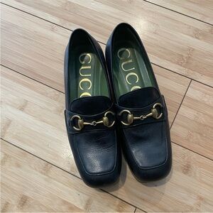Gucci Black Leather Loafers with Gold Accents